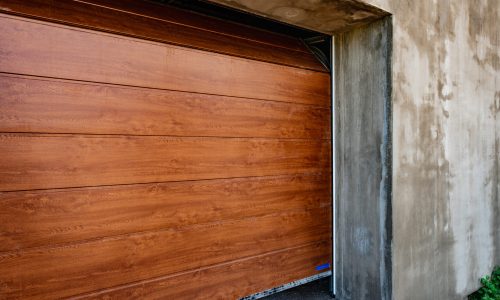 Brown automatic sectional metal garage doors.
